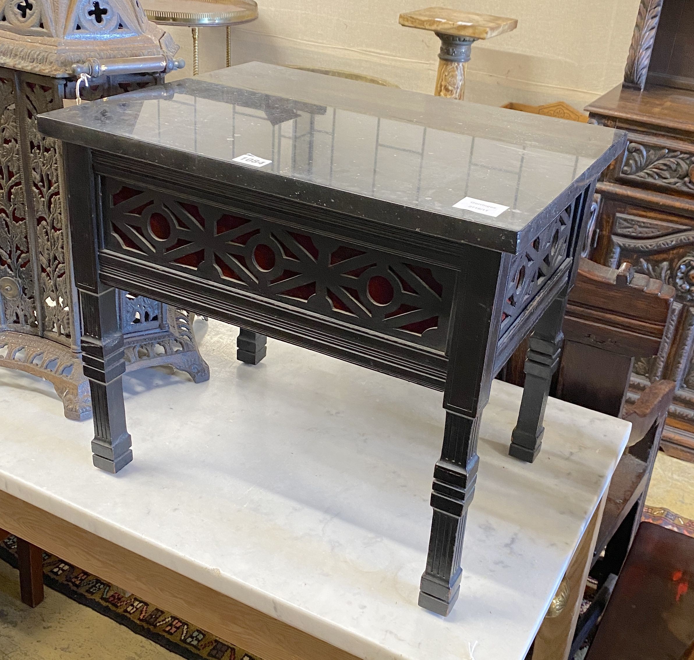 A late Victorian fret cut ebonised marble-topped occasional table, adapted, width 52cm, depth