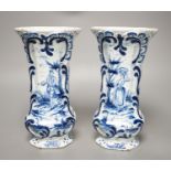 A pair of 19th century Delft blue and white vases 21.5cm