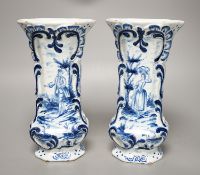 A pair of 19th century Delft blue and white vases 21.5cm