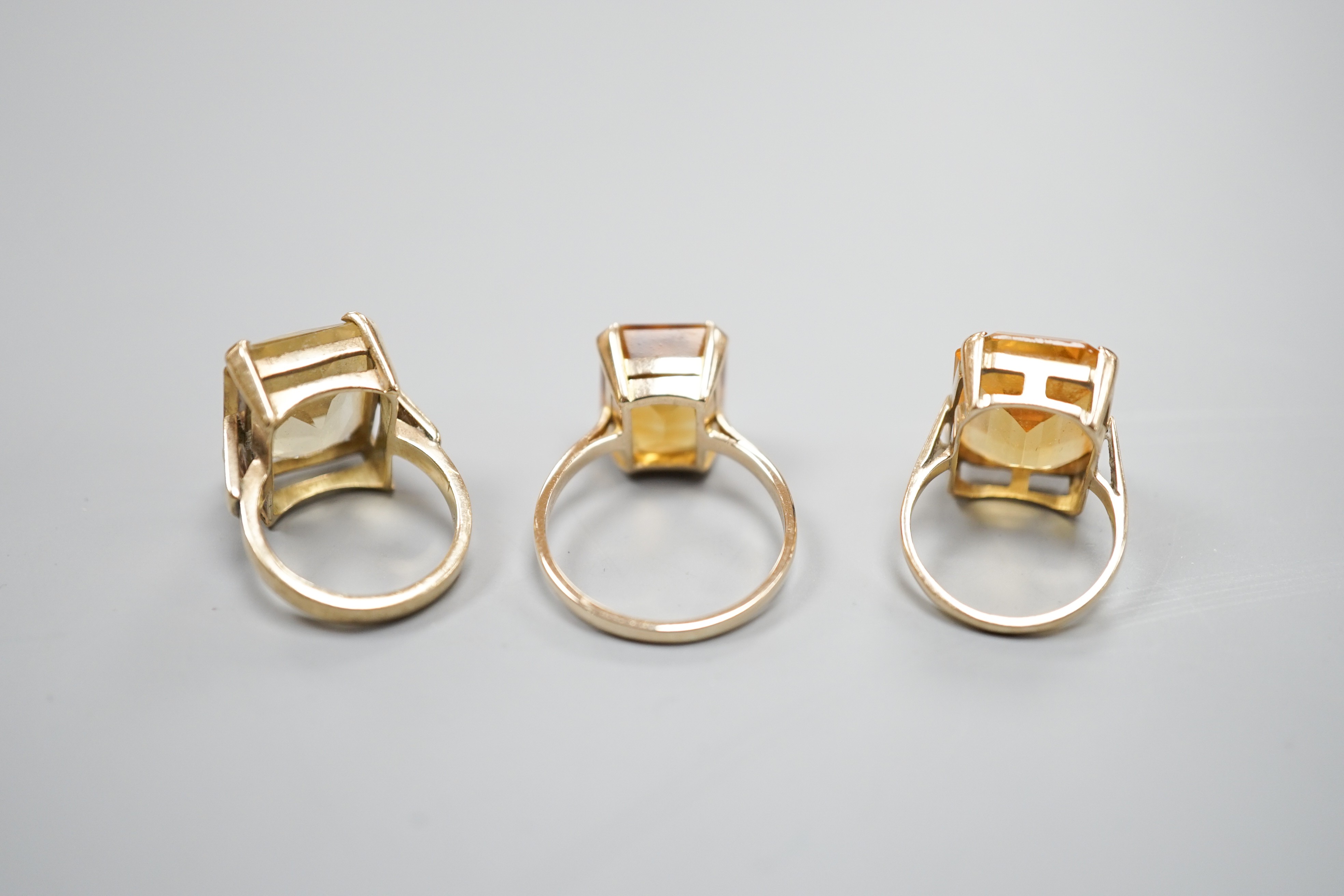Three yellow metal and citrine set dress rings, one stamped 9ct, gross weight 11.9 grams. - Image 4 of 5