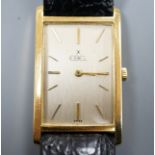 A gentleman's 750 yellow metal Ebel rectangular dial manual wind wrist watch, 0on associated leather