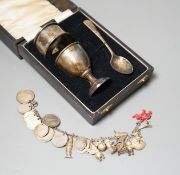 A 1930's cased silver christening set, comprising an egg cup, spoon and napkin ring, together with a