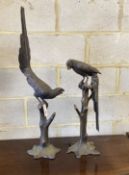 A pair of patinated cast metal macaws, larger height 88cm