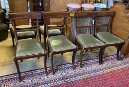 A set of six Regency mahogany sabre leg dining chairs