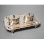 A late Victorian silver rounded rectangular inkstand, with two wells and two pen recesses, Charles