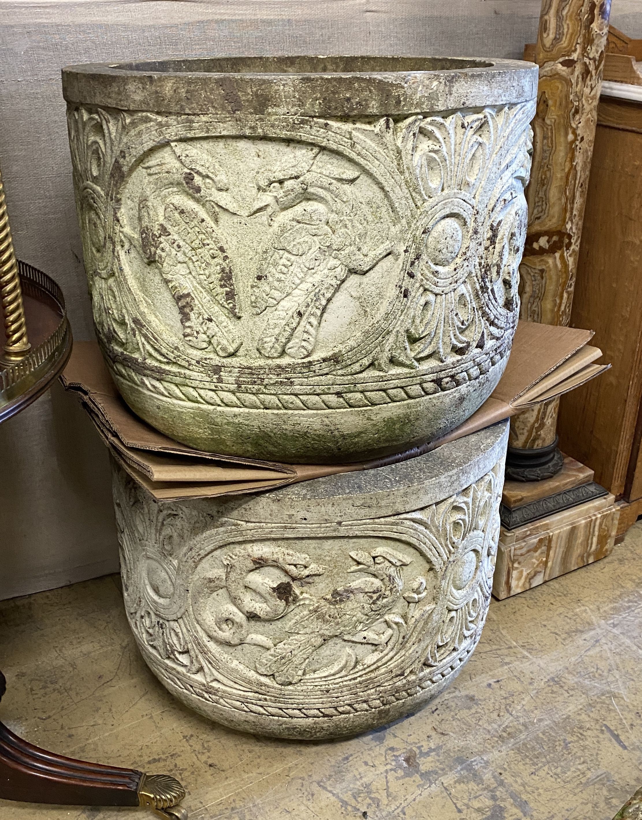 A pair of reconstituted stone circular garden planters, diameter 54cm, height 42cm