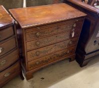 An early 20th century floral painted mahogany chest of drawers, fitted slide, width 90cm, depth