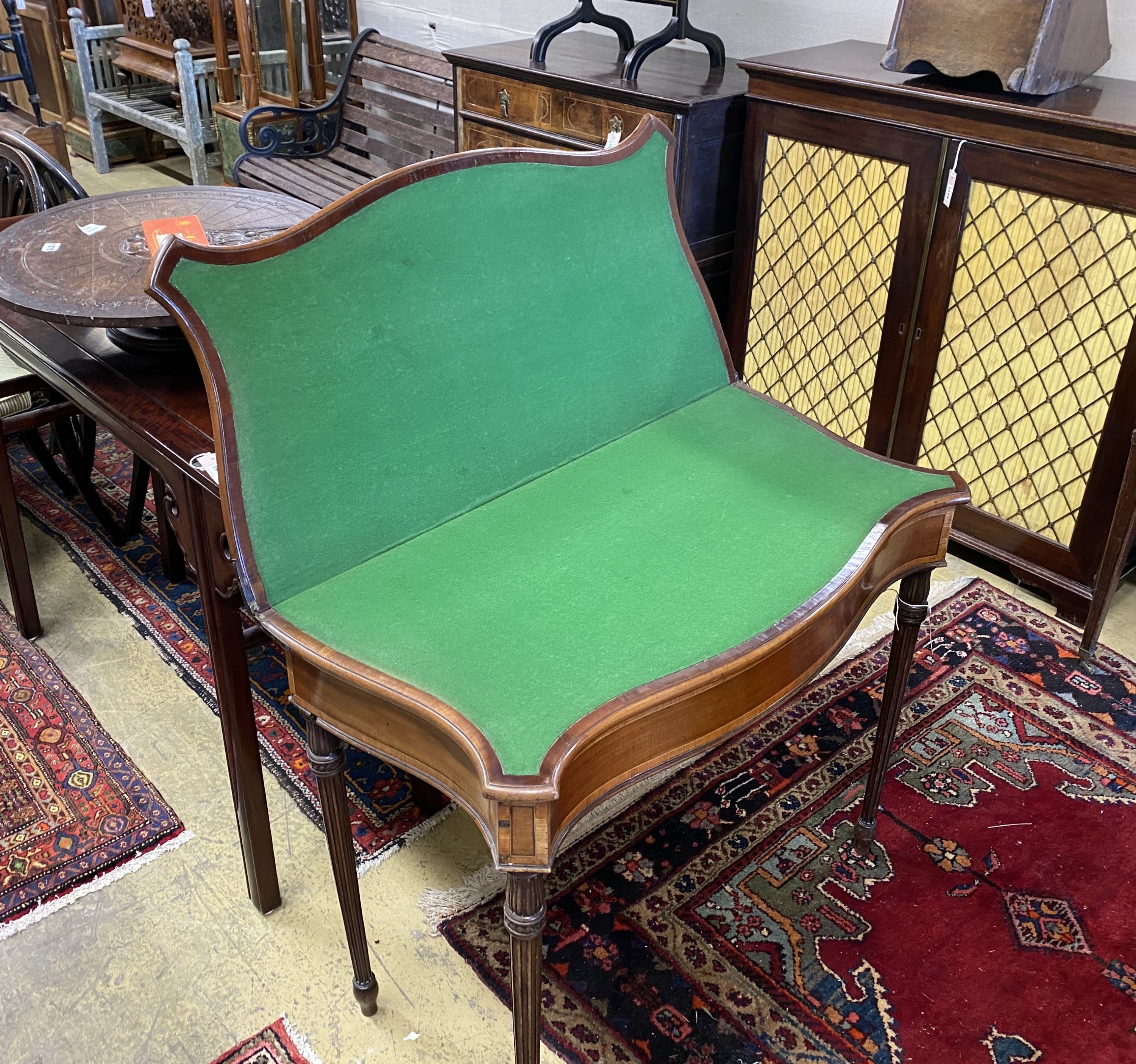 A George III serpentine fronted banded mahogany folding card table, width 88cm, depth 44cm, height - Image 2 of 3