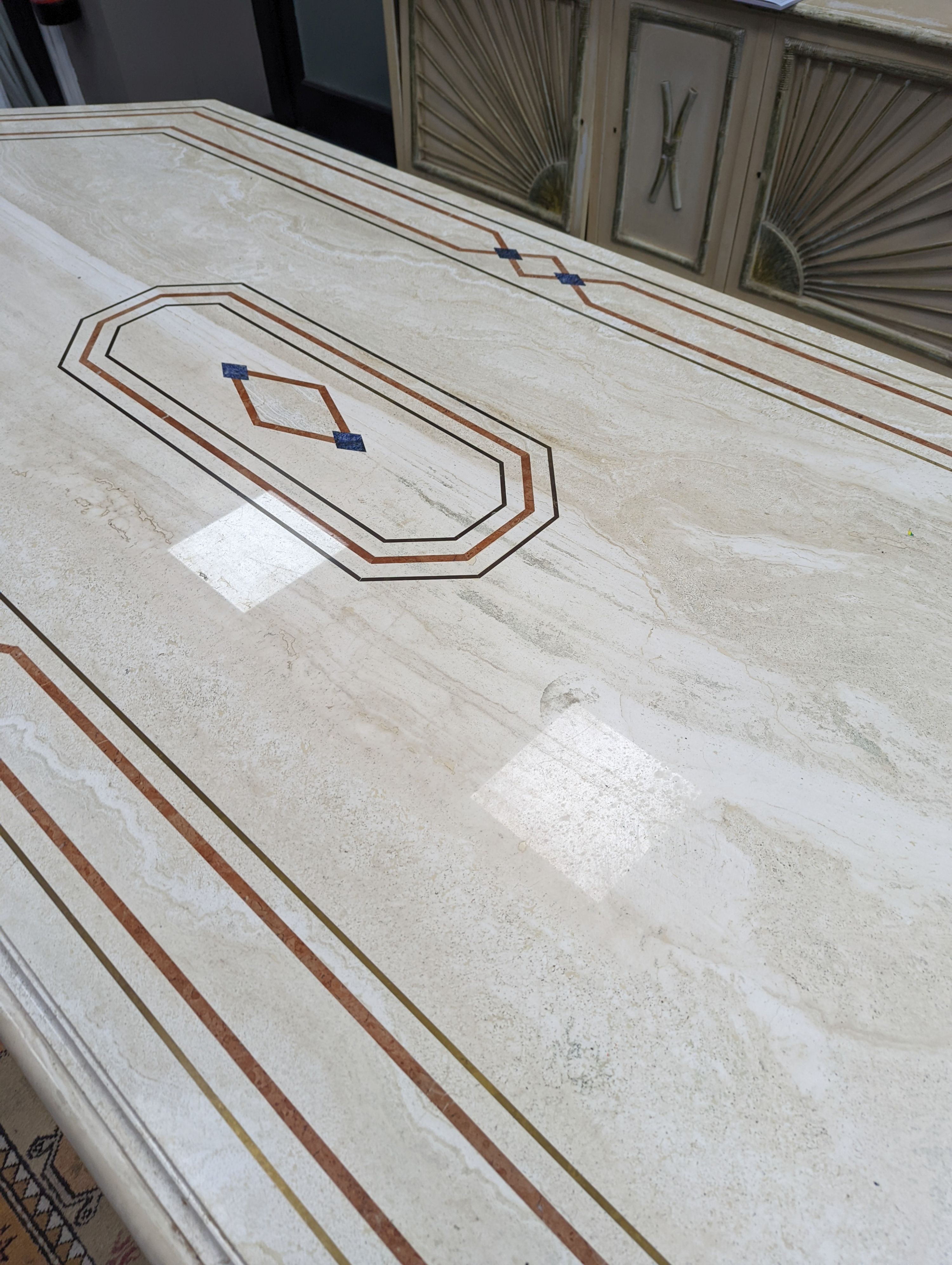 A Travertine marble dining table of elongated ocgtagonal form on twin octagonal column supports, - Image 3 of 7