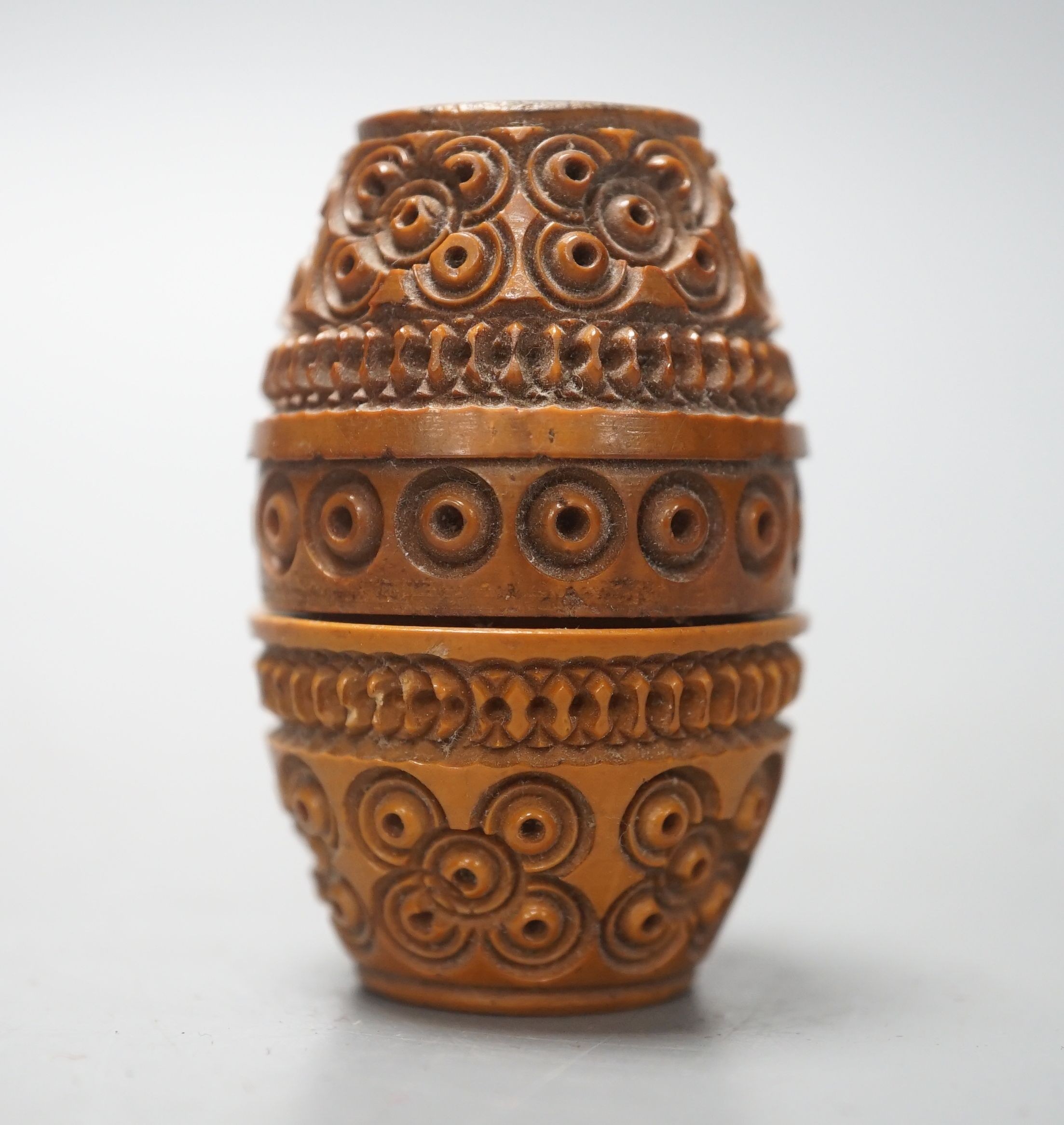 A carved coquilla nut box, 6cms high