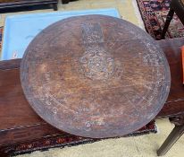 An early 20th century carved oak lazy Susan modelled on King Arthur’s round table, diameter 55cm,