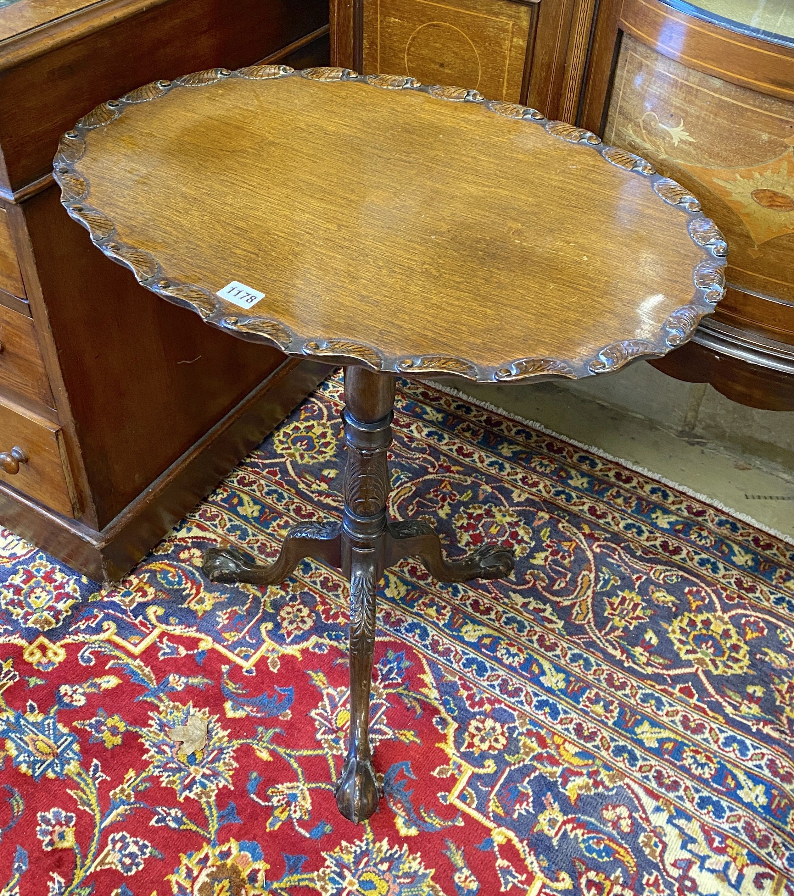 A George III style oval mahogany tripod wine table, width 61cm, depth 45cm, height 67cm