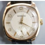 A gentleman's 9ct. gold wristwatch by Garrard in cushion case, silvered dial, baton and Roman