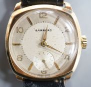 A gentleman's 9ct. gold wristwatch by Garrard in cushion case, silvered dial, baton and Roman