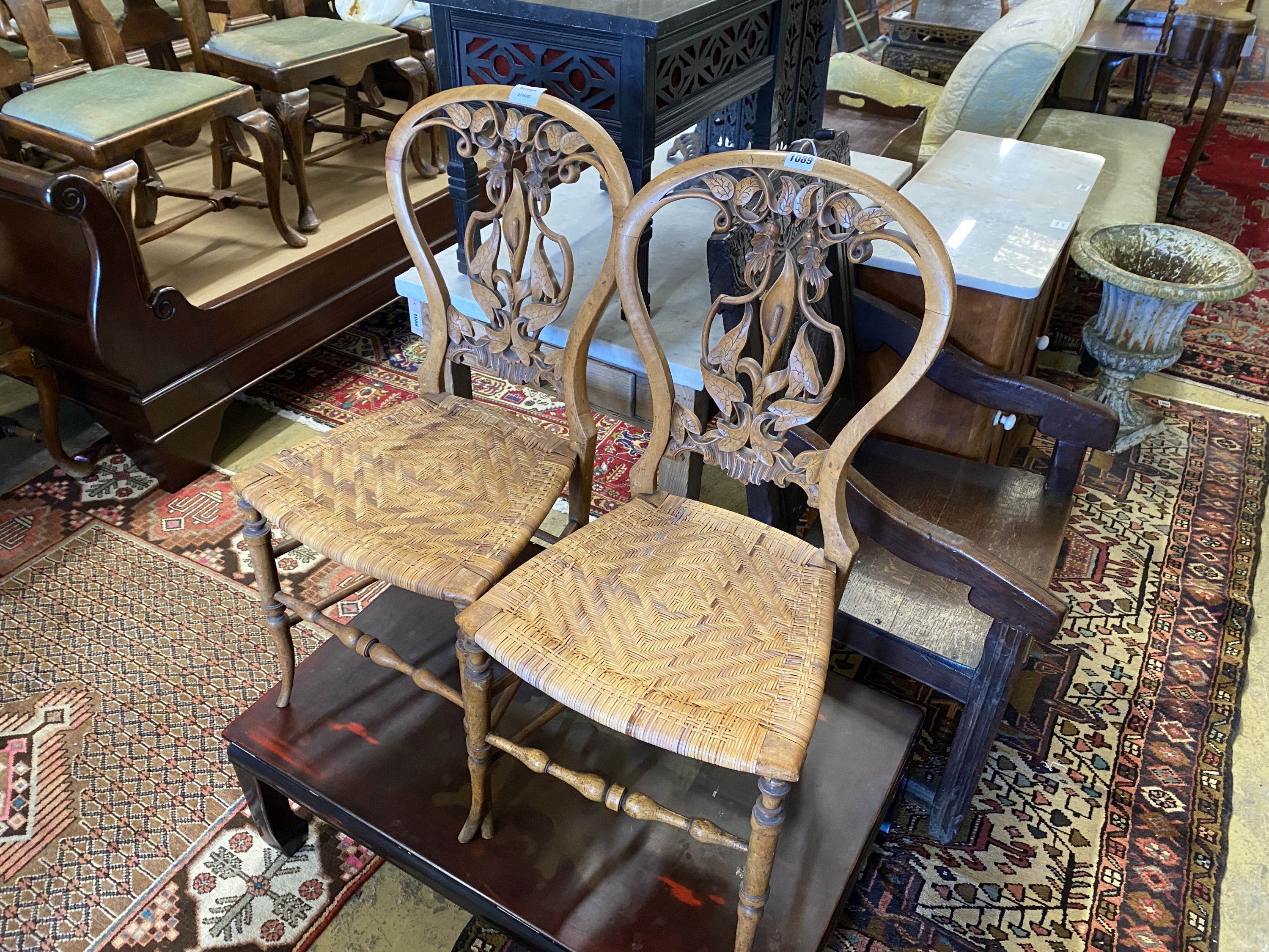 A pair of Victorian floral carved walnut cane seated side chairs - Image 2 of 2