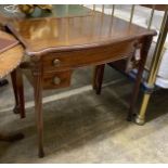 A Victorian style serpentine mahogany writing table, width 86cm, depth 51cm, height 76cm