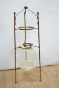 A W.A.S Benson brass and copper three tier stand, with two Vaseline glass dishes (upper dish