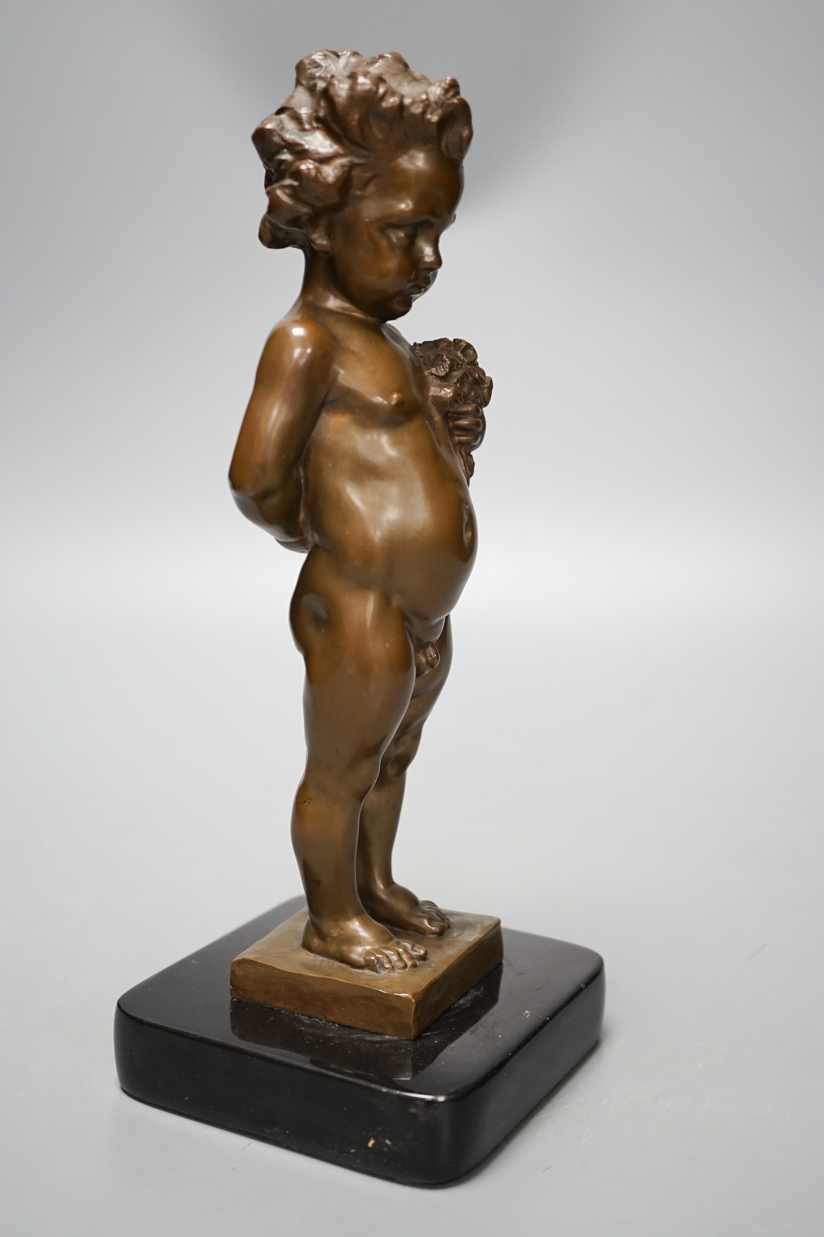 A bronze of a putto holding flowers, signed ‘M.Müller’ 25cm - Image 5 of 5