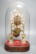 A Victorian brass skeleton clock, with single fusee movement, under a glass dome 43 cms high.