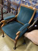 A Victorian maple upholstered open armchair, width 62cm, depth 60cm, height 85cm