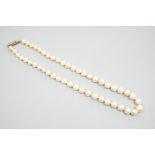 A single strand graduated pearl necklace (not tested for natural), with yellow metal and three stone