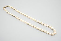 A single strand graduated pearl necklace (not tested for natural), with yellow metal and three stone