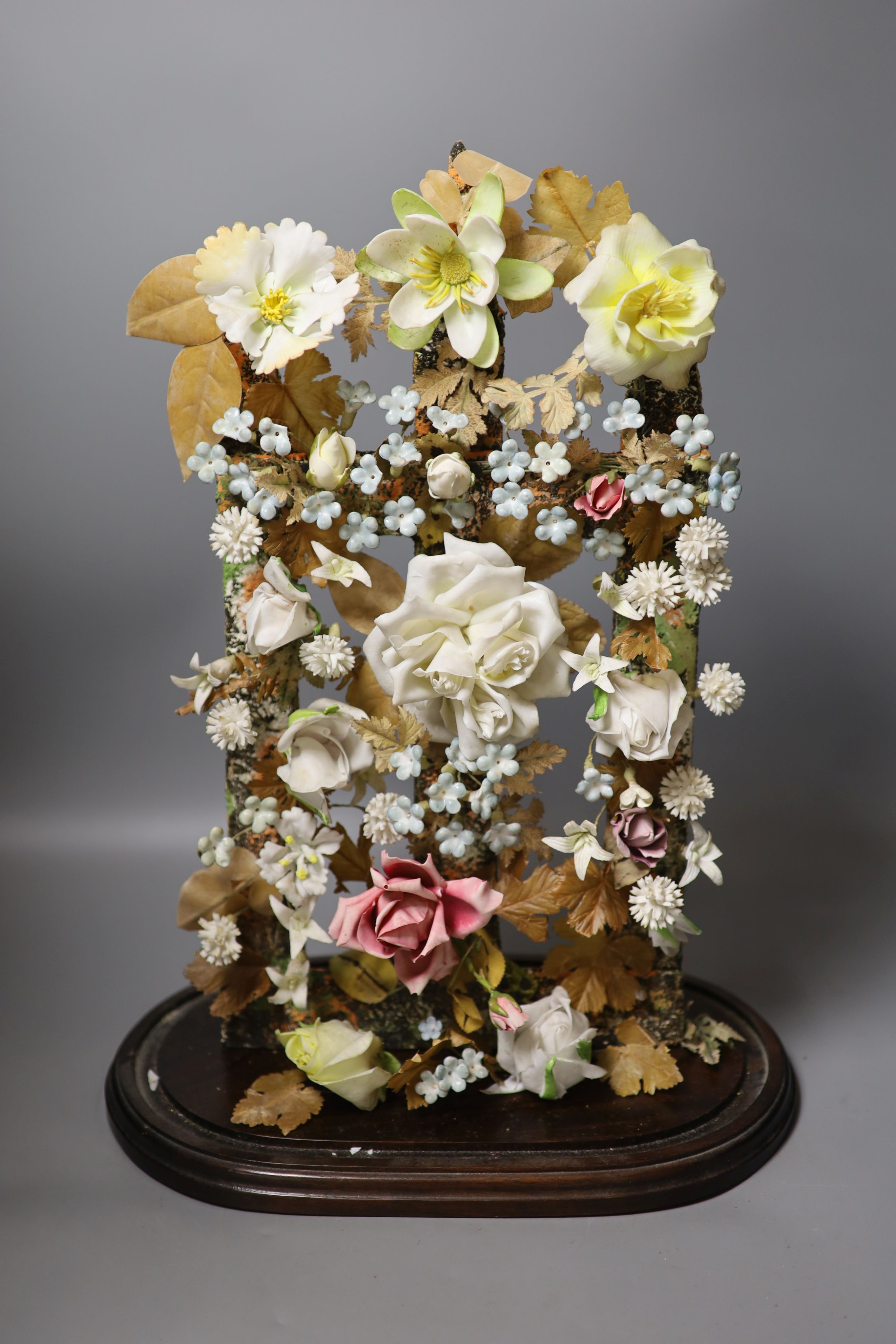 A late 19th century model of porcelain flowers under a glass dome 52cm total height - Image 2 of 5