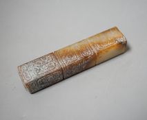 A Chinese archaistic white and russet jade handle mount, carved in relief with three registers of