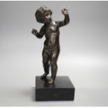 A 20th century bronze putto on wooden stand 29cm including stand