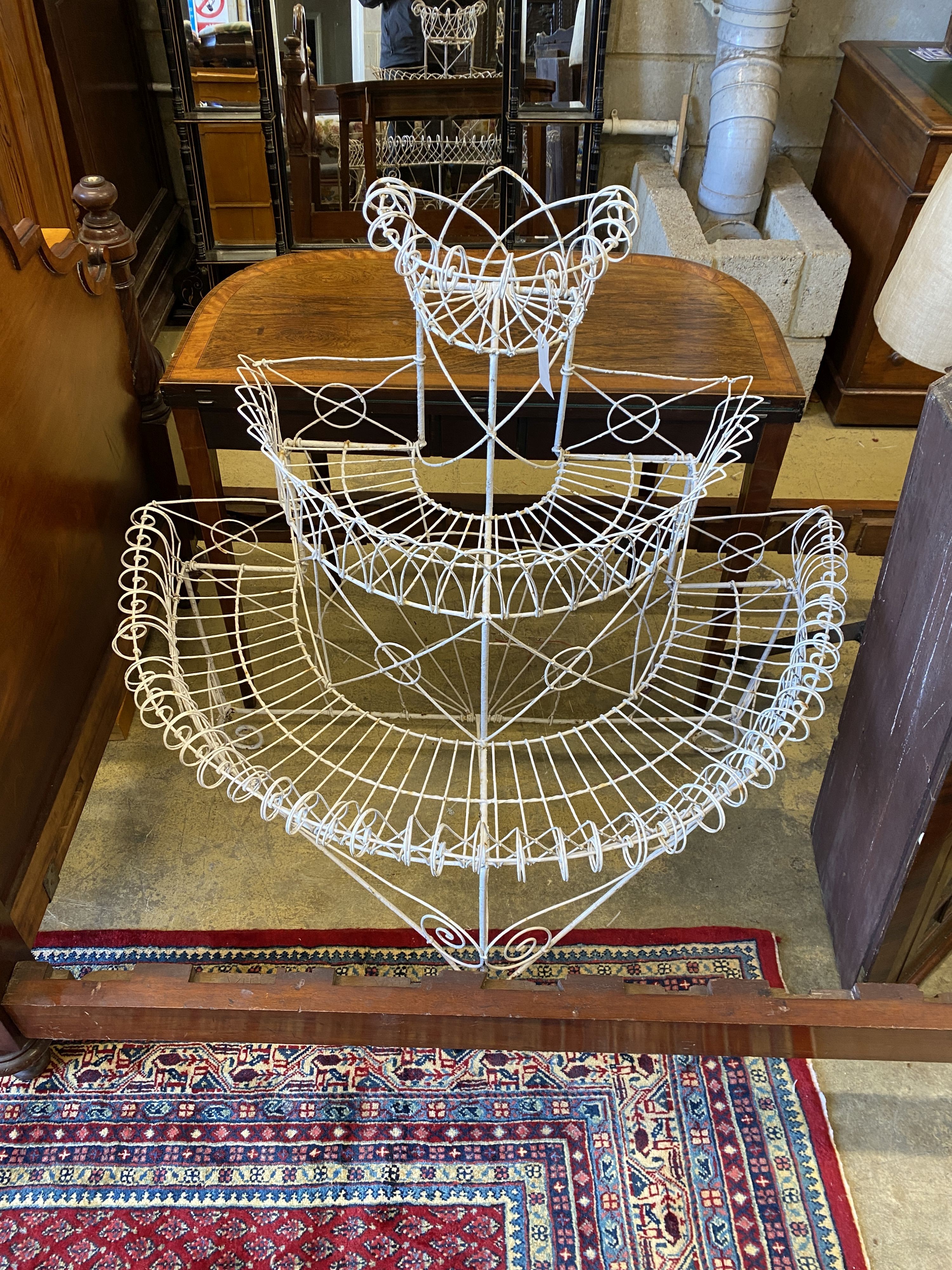 A Victorian wirework bow front three tier pot stand, width 104cm, depth 60cm, height 107cm - Image 2 of 2