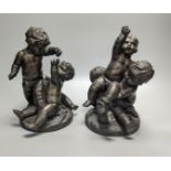 After Clodion, a pair of early 20th century bronze groups of putto, tallest 25cm