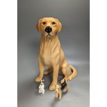 A large Royal Doulton figure of a seated Labrador (No. 2314), height 34cm, a small Beswick