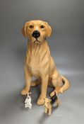 A large Royal Doulton figure of a seated Labrador (No. 2314), height 34cm, a small Beswick