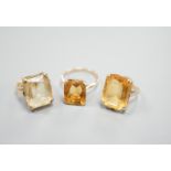 Three yellow metal and citrine set dress rings, one stamped 9ct, gross weight 11.9 grams.
