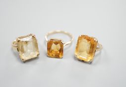 Three yellow metal and citrine set dress rings, one stamped 9ct, gross weight 11.9 grams.