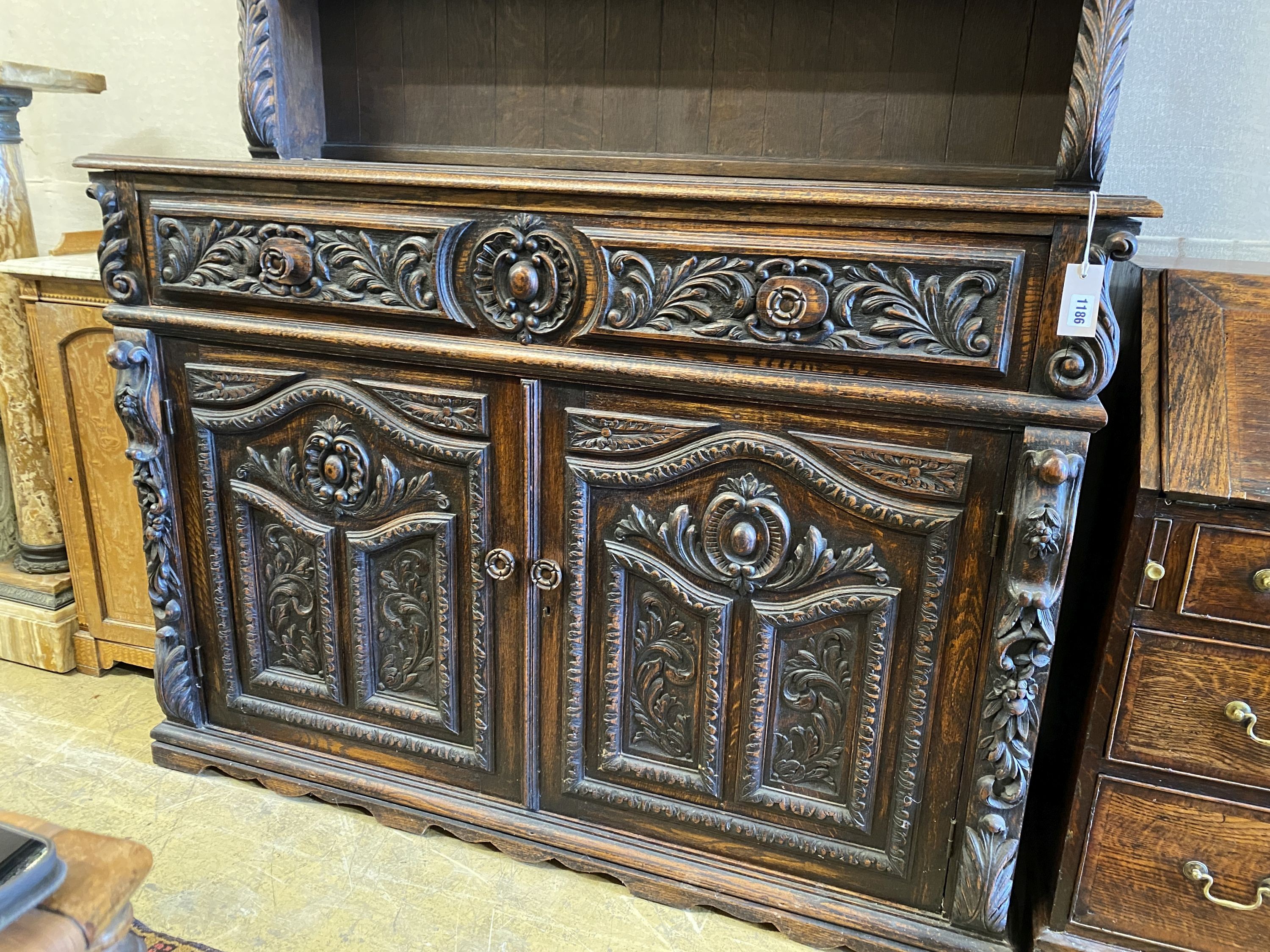 A late 19th century Flemish carved oak dresser, length 135cm, depth 50cm, height 192cm - Image 2 of 3