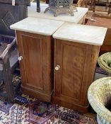A pair of Victorian satin walnut bedside cupboards with white marble tops, width 39cm, depth 34cm,