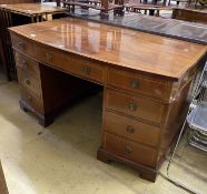 An Edwardian satinwood banded mahogany bow front kneehole pedestal desk, width 137cm, depth 76cm,