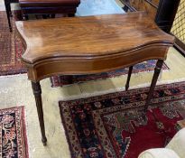 A George III serpentine fronted banded mahogany folding card table, width 88cm, depth 44cm, height