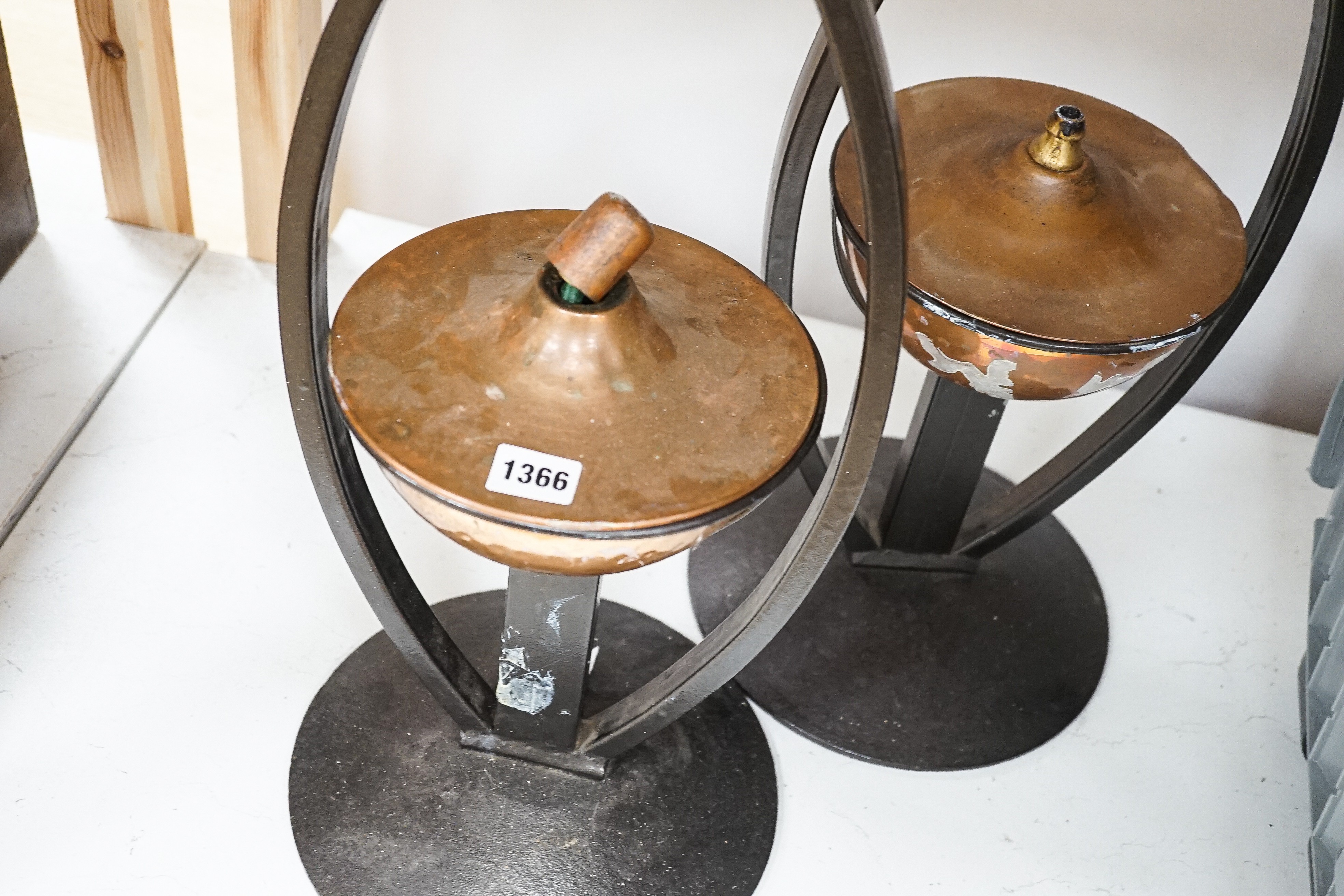 A pair of decorative copper lamps in arched mounts, 61 cms high. - Image 4 of 4