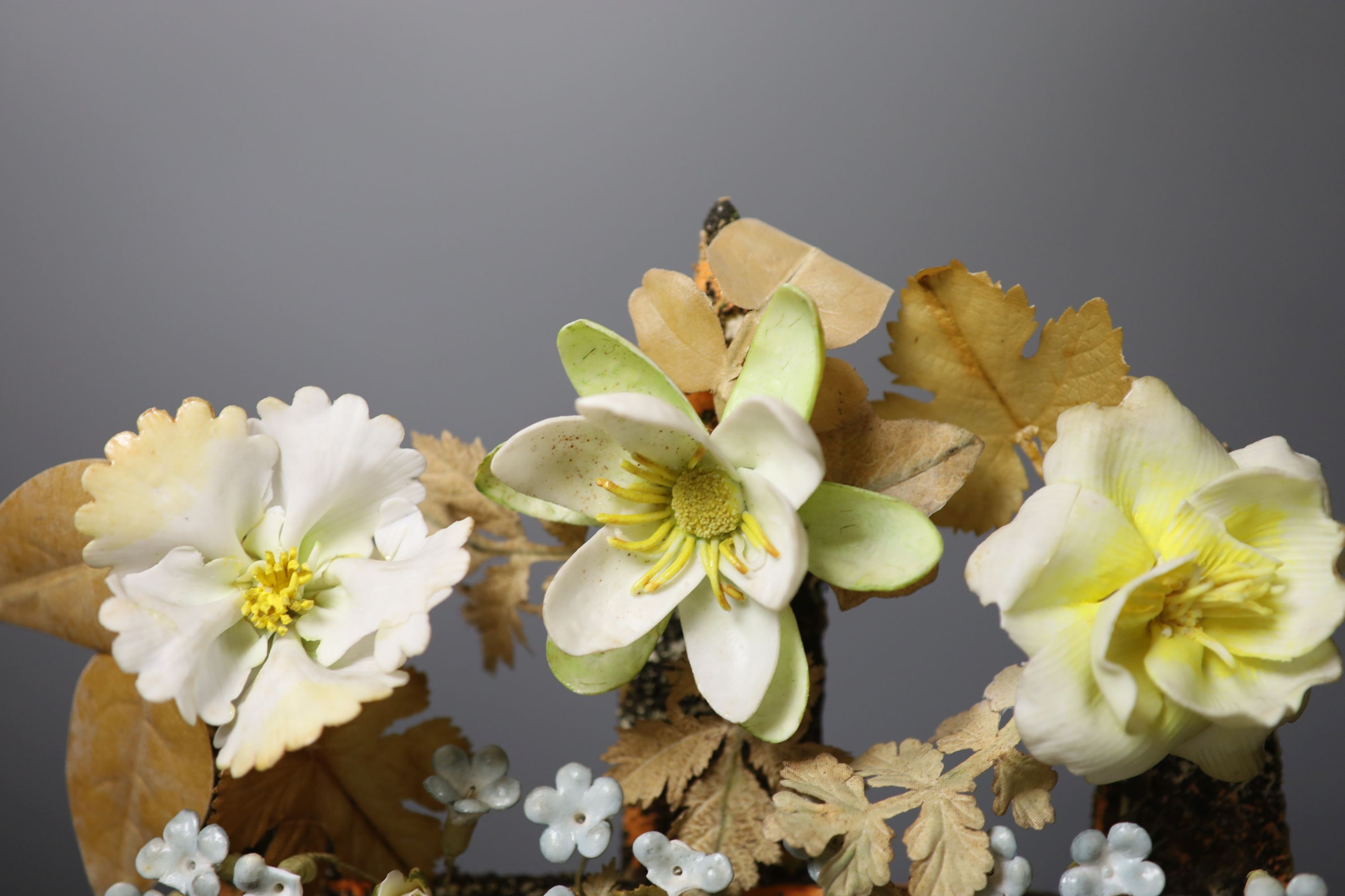 A late 19th century model of porcelain flowers under a glass dome 52cm total height - Image 3 of 5