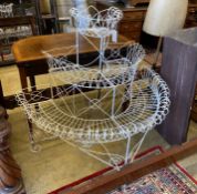 A Victorian wirework bow front three tier pot stand, width 104cm, depth 60cm, height 107cm