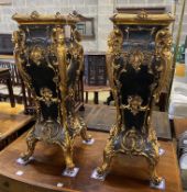 A pair of painted metal 18th century style pedestals, width 35cm, height 104cm