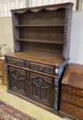 A late 19th century Flemish carved oak dresser, length 135cm, depth 50cm, height 192cm