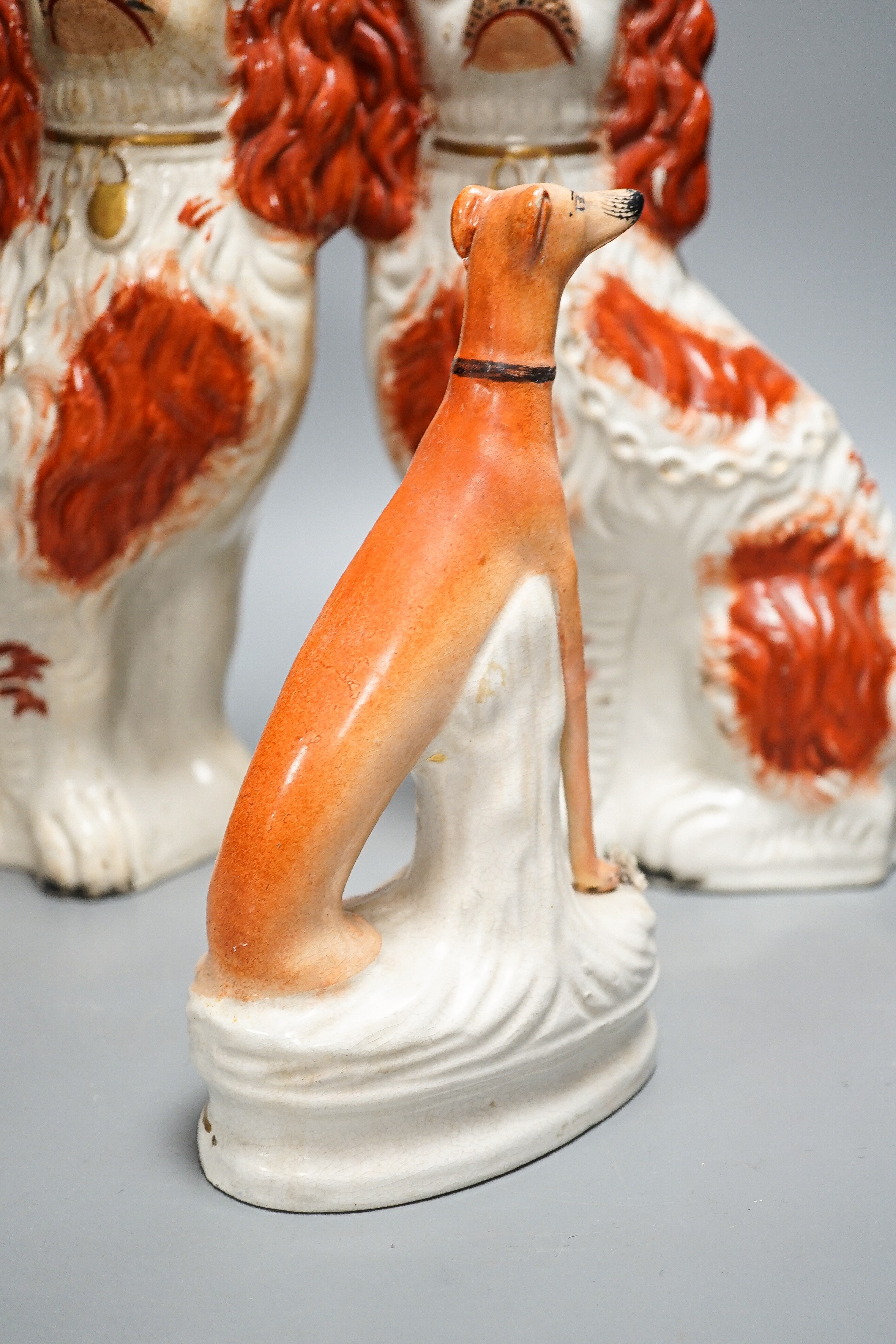 A pair of Victorian Staffordshire Spaniel chimney dogs and a greyhound, chimney dogs 31 cms high. - Image 4 of 8