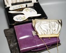 A boxed, three piece silver plated translucent enamelled dressing set, a purple leather stationary