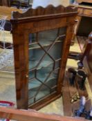 A George III walnut hanging corner cabinet, width 60cm, depth 28cm, height 102cm