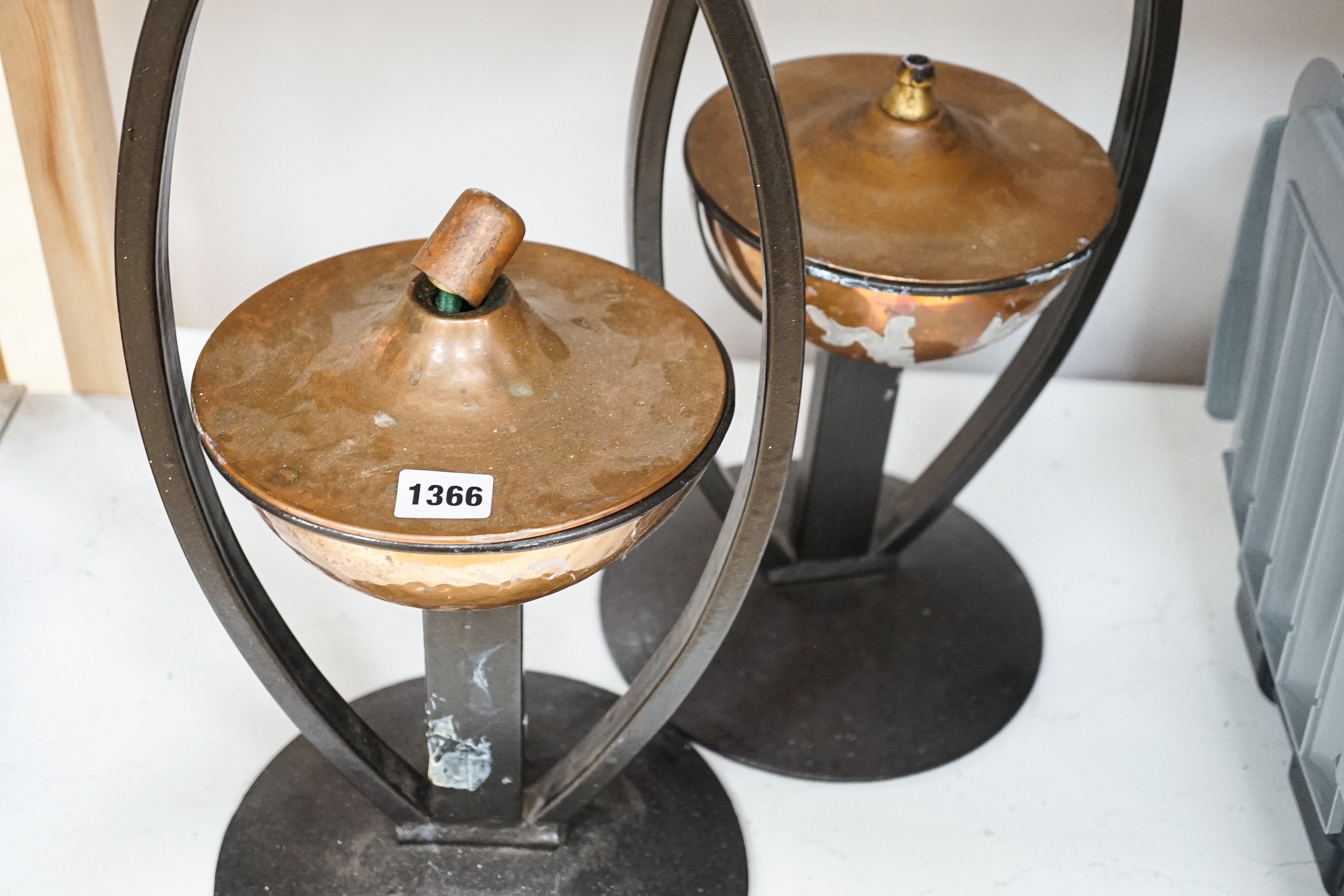A pair of decorative copper lamps in arched mounts, 61 cms high. - Image 3 of 4