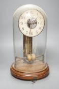 A Bulle electric pendulum clock, with large central brass pillar supporting the 14cm. dial, under