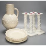 A set of seven early 19th century creamware plates, four later creamware candlesticks and an ivory